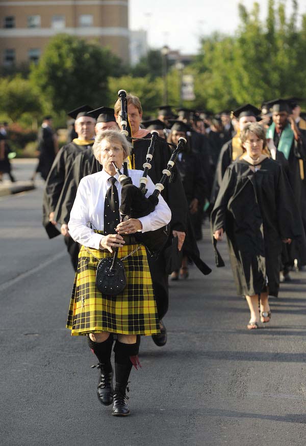 Winter Taylor plays bagpipes at a 2010 KSU commencement ceremony
