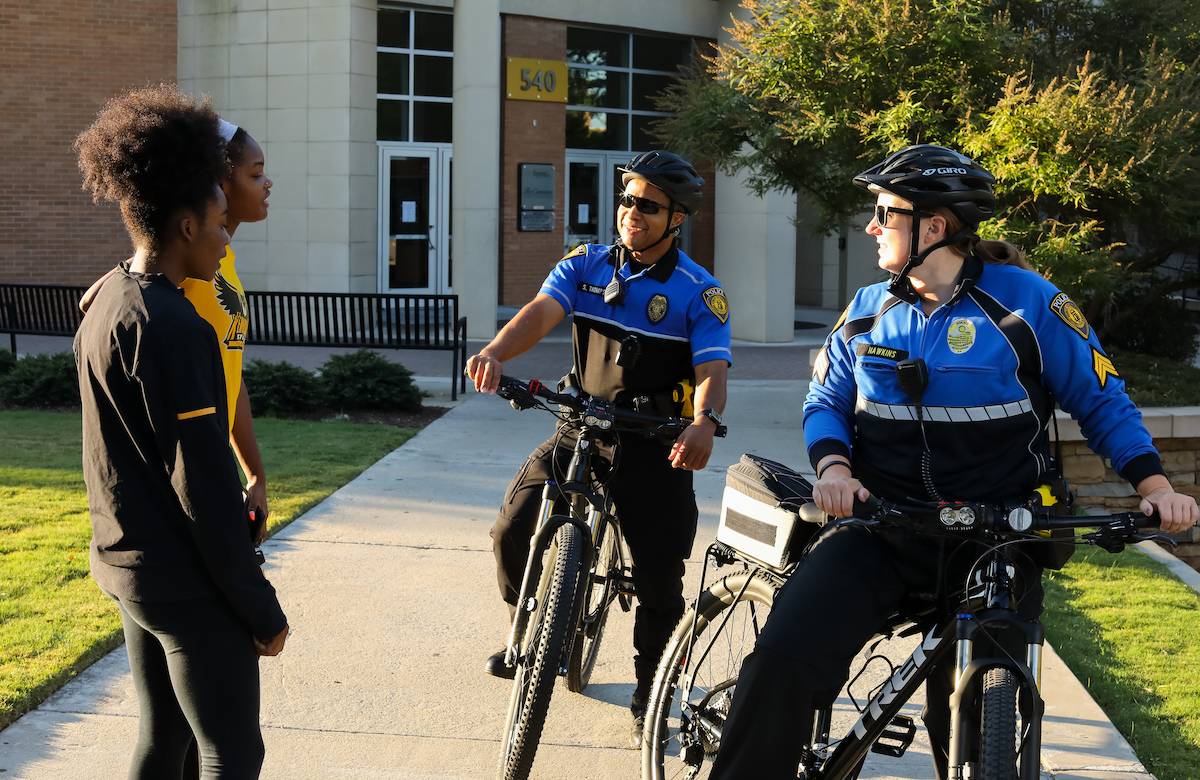 KSU PD bicycle officers and students