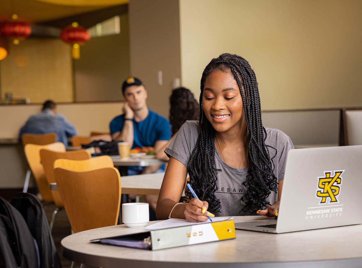 Photo of student studying on laptopn